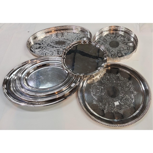 720 - A silver plated set of 3 oval graduating platters; a Georgian style salver; a gadrooned circular tra... 