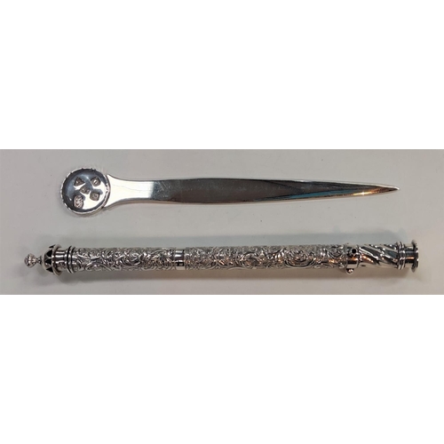 723 - A hallmarked silver meat skewer/letter opener, London circa 1981; a scribe's pen/brush holder of cyl... 