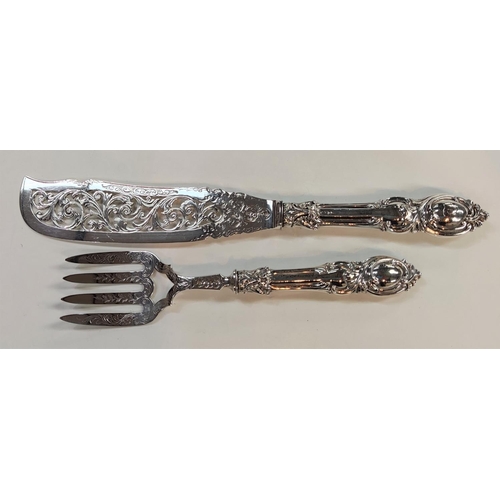 724 - A hallmarked silver pair of fish servers, ornately pierced and embossed, Birmingham 1853