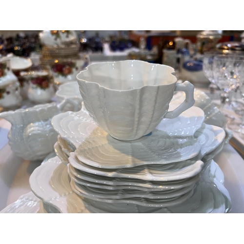 518 - A Shelley style scalloped and ribbed white glaze 21 piece tea service