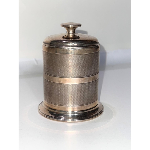 666 - A 1930's hallmarked silver cylindrical cigarette dispenser