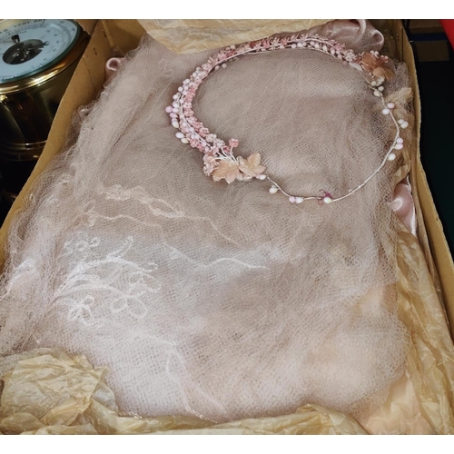 104 - An early 20th century pink satin wedding dress; a boxed set of tablecloth/napkins, with lace edging