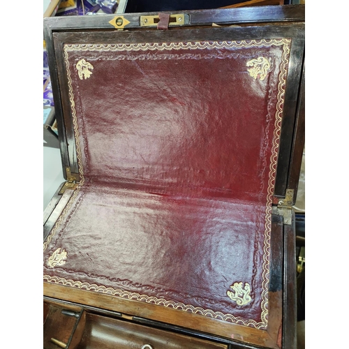 147 - A Victorian slope front lap desk; a rosewood fold out lap desk with mother of pearl inlay