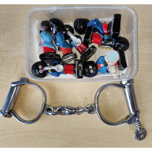 151 - A pair of vintage chrome handcuffs, wooden boxes, a selection of Robertson's Football team players, ... 