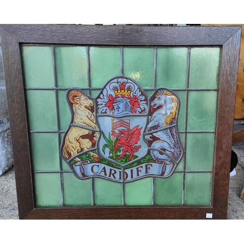 190 - An oak framed leaded stained glass crest of Cardiff Crest 50 x 57cm.