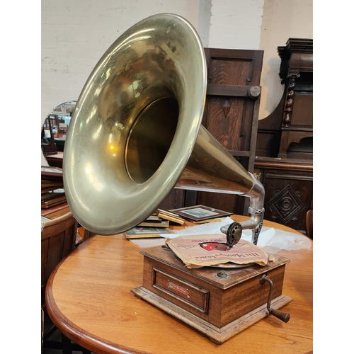 191 - A vintage record player 'The Balmoral' with brass horn and two classic record sets.