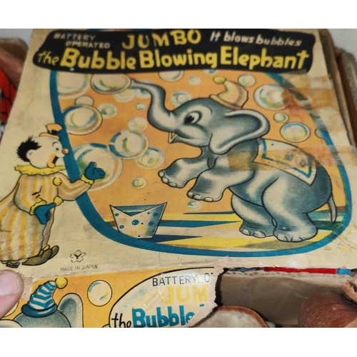 246 - A selection of vintage toys, boxed Dumbo The Blowing Elephant, diecast vehicles, marbles etc