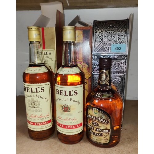 402 - Two boxed bottles of vintage Bells Old Scotch Whiskey, extra special one gilt box and a bottle of 12... 