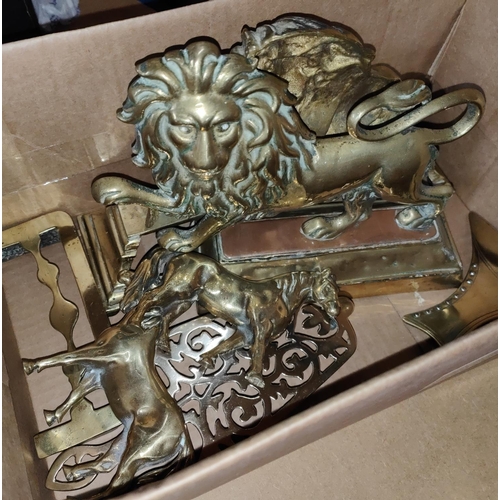 59 - Two 19th century brass lion fire ornaments, each on plinth base; other metalware