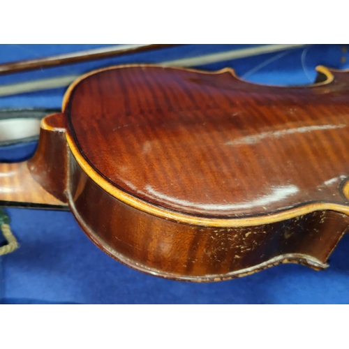 66A - A late 19th/early 20th century two piece back violin in case, with bow.