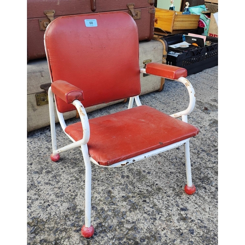 68 - A child's 'Atom ware' style chair in red vinyl