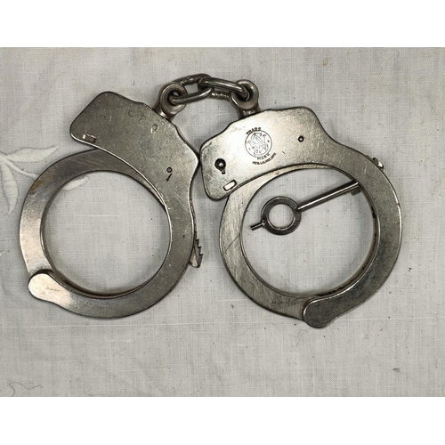 78A - A pair of Smith & Wesson handcuffs.