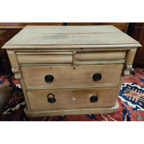 974 - A Victorian stripped pine chest of 2 long and two frieze drawers.