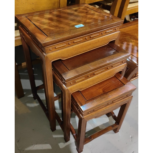 990 - A reproduction oriental hardwood nest of 3 tables50 years old and from Hong Kong