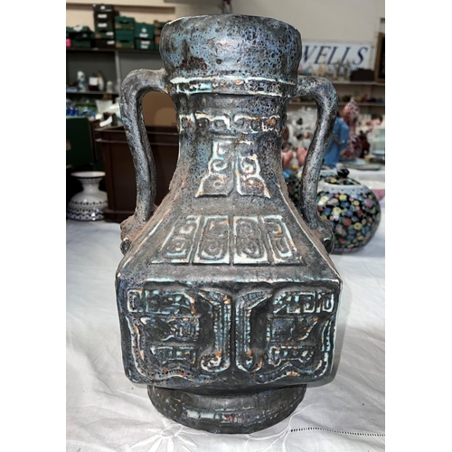 510 - A stoneware squared vase with double handle and geometric designs.