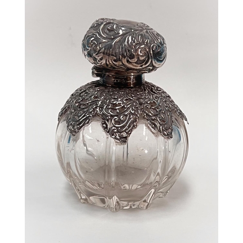 616A - A globular glass scent bottle with embossed silver top and mounts