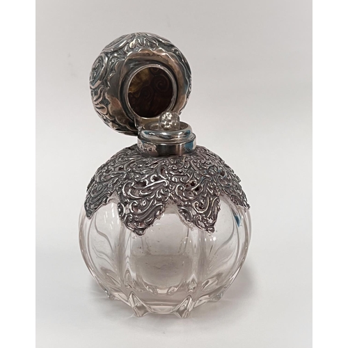 616A - A globular glass scent bottle with embossed silver top and mounts