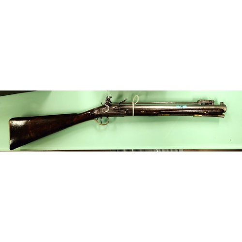 157 - A late 18th/early 19th century flintlock blunderbuss with spring loaded bayonet, with walnut stock b...