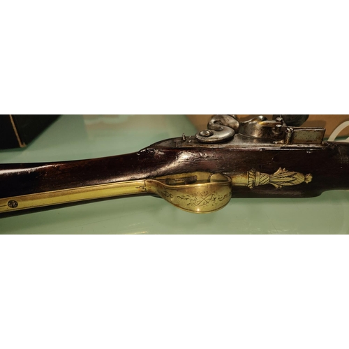 157 - A late 18th/early 19th century flintlock blunderbuss with spring loaded bayonet, with walnut stock b... 