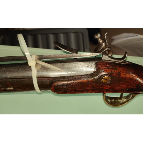 157 - A late 18th/early 19th century flintlock blunderbuss with spring loaded bayonet, with walnut stock b... 