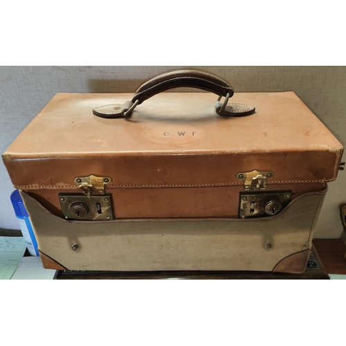 172A - Aux Etats Unis Luggage; a leather early 20th century travel vanity case with fitted interior with mo... 