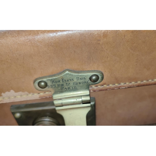 172A - Aux Etats Unis Luggage; a leather early 20th century travel vanity case with fitted interior with mo... 