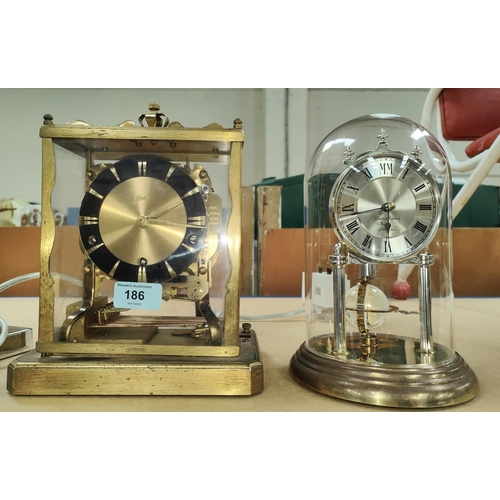 186 - A 1950's gilt metal striking mantle clock by Shatz + a 400 day clock