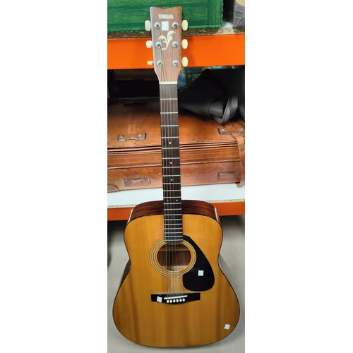 9 - A vintage acoustic Yamaha steel strung guitar FG-400A; A vintage tan coloured leather travel suitcas... 
