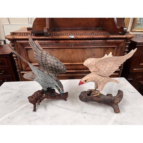 493E - A carved and painted wood eagle; a carved boxwood eagle