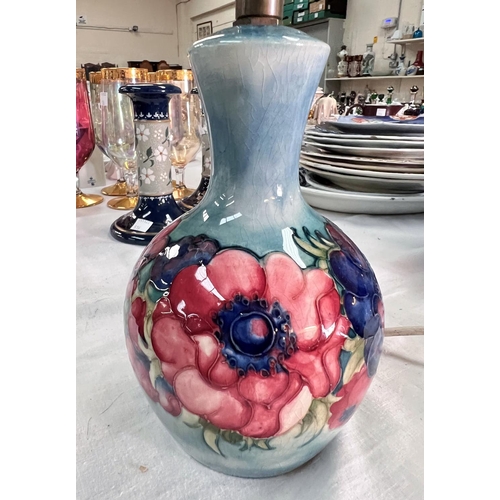 626A - A Moorcroft table lamp base, decorated with anemones against a blue ground.