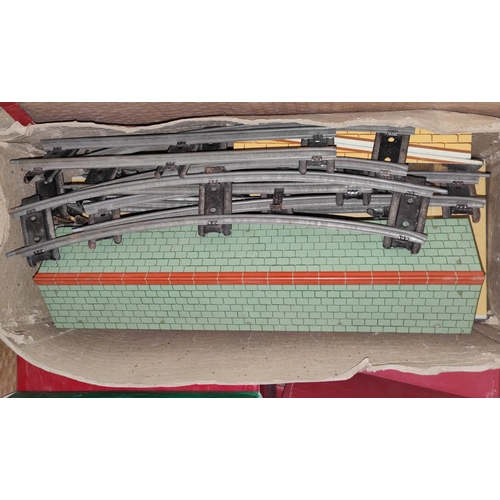 198 - A Hornby train boxed tin plate clockwork 'O' gauge set loco carriages etc, track, signals and variou... 