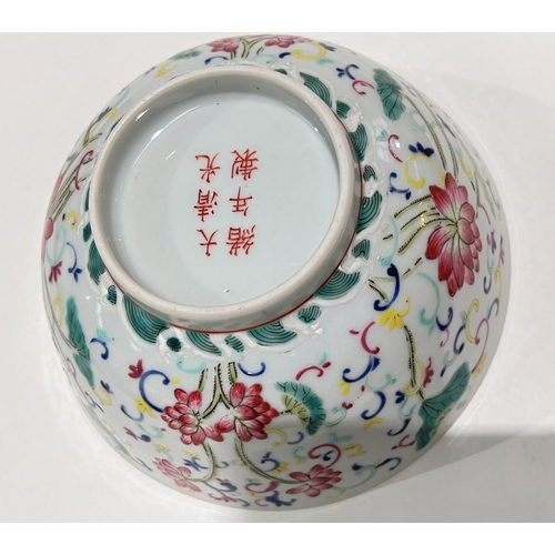 441 - A Chinese famille rose bowl with polychrome decoration of flowers, 6 character mark, ht. 15.5cm