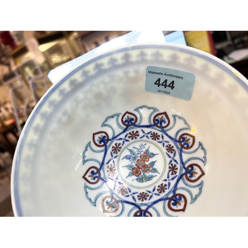 444 - A Chinese famille vert bowl with decoration of scrolling flowers, similar interior, seal mark to bas... 