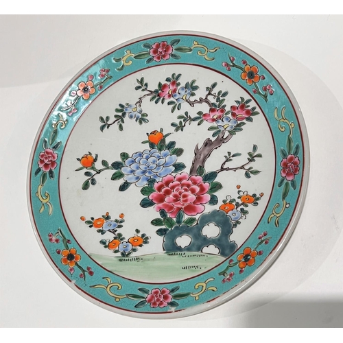 451 - A Chinese polychrome dish with turquoise border, central flowers with red mark and incised mark to b... 