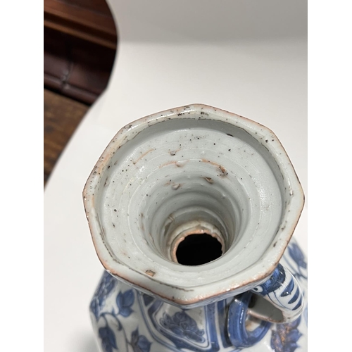 463 - A Chinese blue and white vase in the Yuan manner decorated with birds and double handle, ht. 34cm