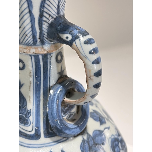 463 - A Chinese blue and white vase in the Yuan manner decorated with birds and double handle, ht. 34cm