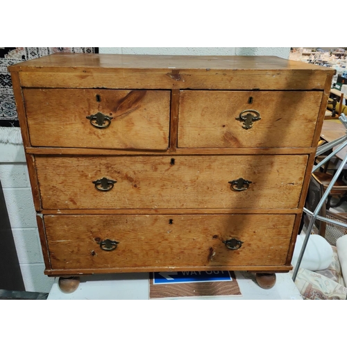 972 - A 19th century pine chest of two long and two short drawers.