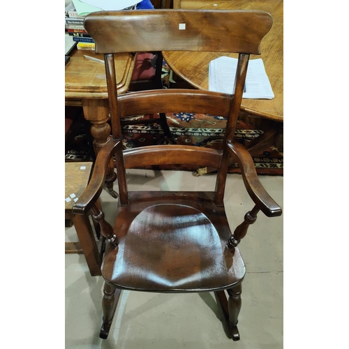 984 - A 19th century stained wood ladder back rocking armchair; a stained wood spindle back armchair.