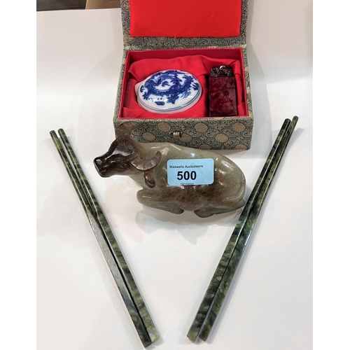 500 - A jade coloured hard stone carving of an ox; two pairs of jade coloured stone chopsticks and a boxed... 