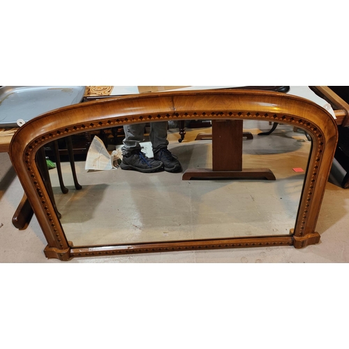 979 - An arch top, walnut & marquetry over mantle mirror. 98 x 57cm max.