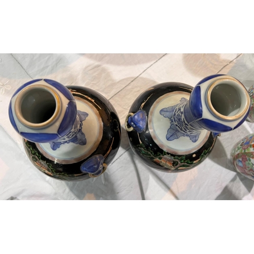 508 - A pair of Chinese Famille Noir vases with blue and white highlights, traditional scenes with 6 chara... 