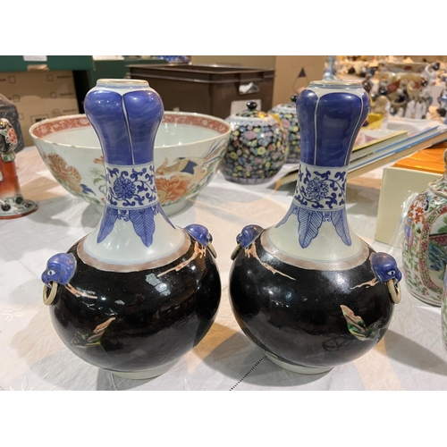 508 - A pair of Chinese Famille Noir vases with blue and white highlights, traditional scenes with 6 chara... 