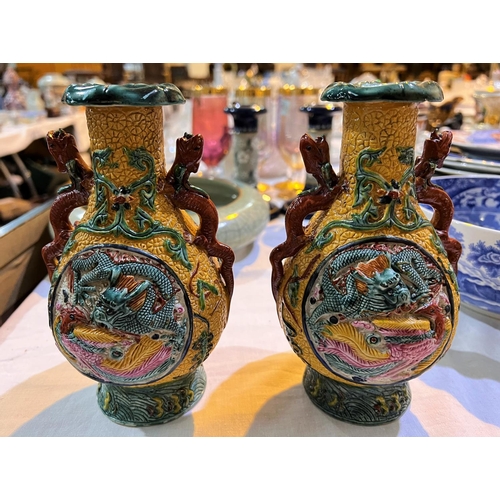 515B - A pair of early 20th century Chinese moulded vases with Qianlong seal marks to bases with multicolou... 