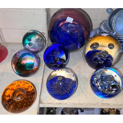 651A - Eight glass paperweights, mostly Caithness, 2 larger size