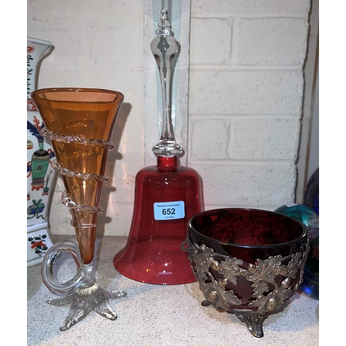 652 - A Victorian cranberry glass bell ornament, 32cm, a sweetmeat dish in metal mount and another piece