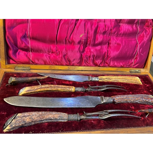 717 - An oak cased antler handle carving set