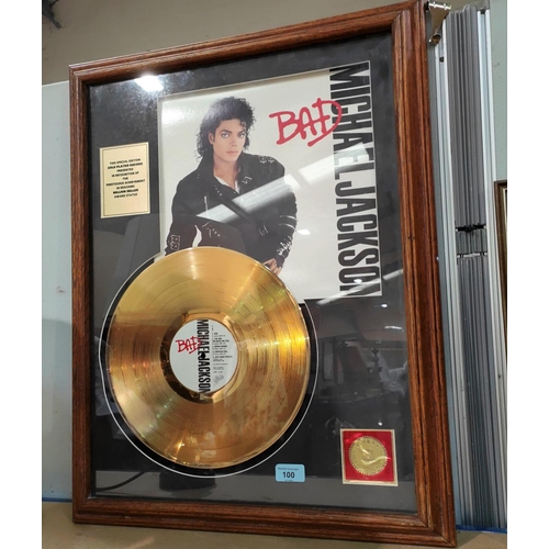 100 - A Michael Jackson gold framed record for Bad, a selection of various world souvenirs, other collecta... 