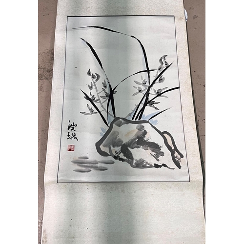 470A - A Chinese scroll painting of a rock decorated with flowers, seal signature