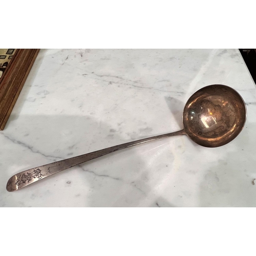 659 - A Georgian Irish Old English pattern hallmarked silver soup ladle, crested, 1799