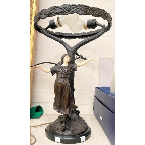 51 - A bronze figural table lamp, c. 1920, the figure with ivory arms, face and neck in 3 separate pieces... 